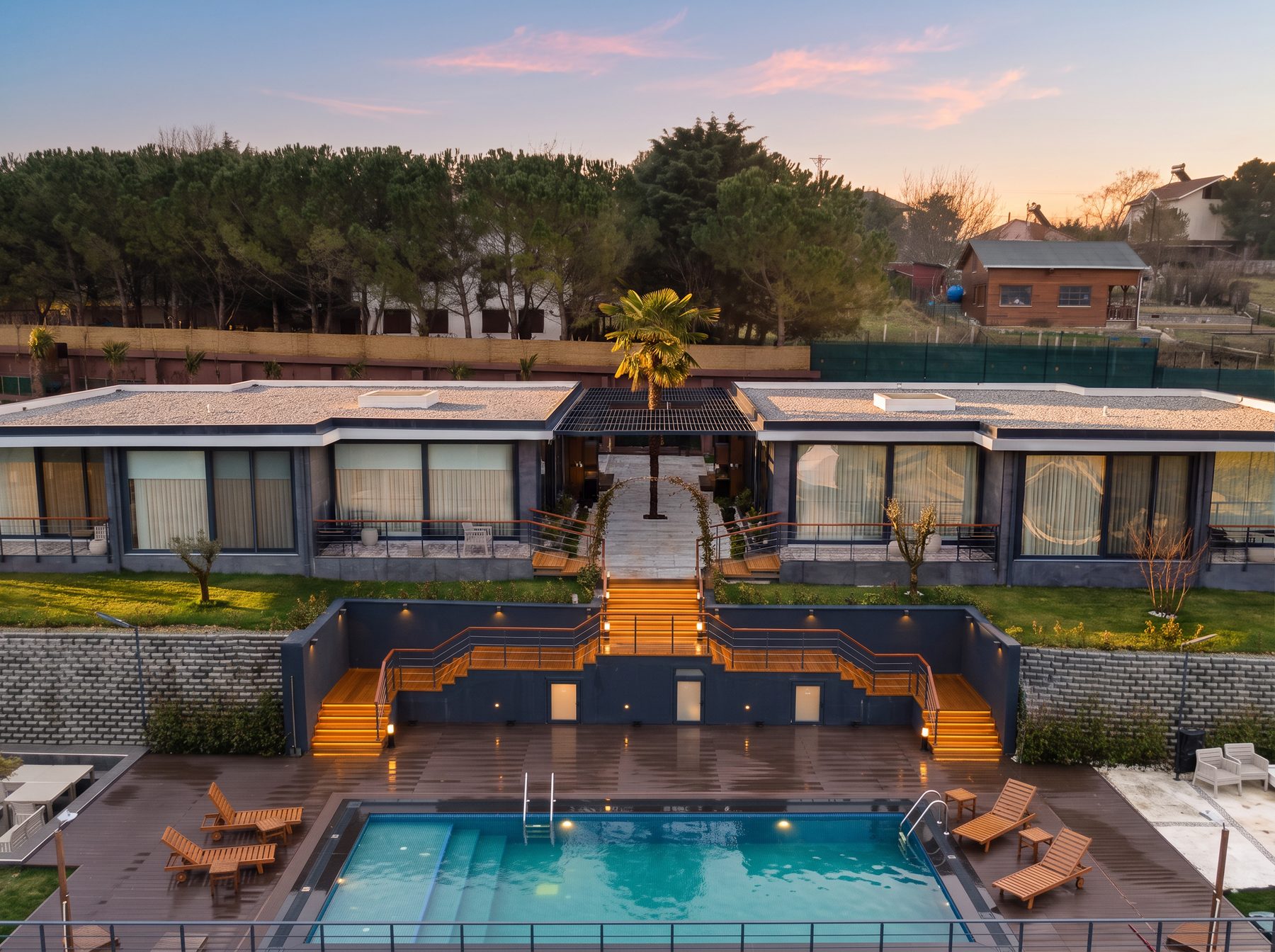 Garden elevation of the two villas and the shared pool terrace