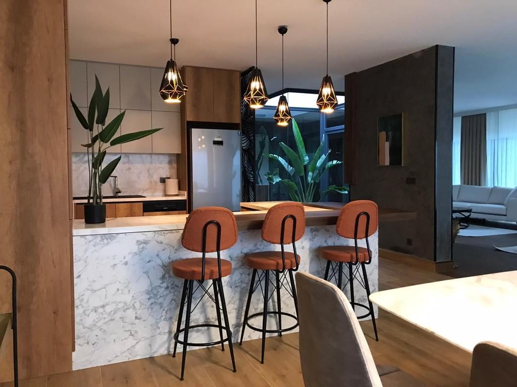 Open kitchen with marble breakfast bar